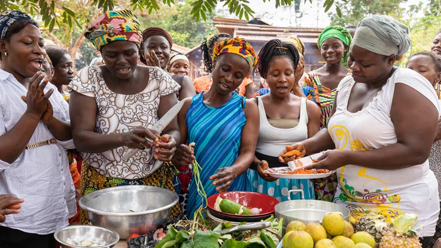 African women cooking traditional food 