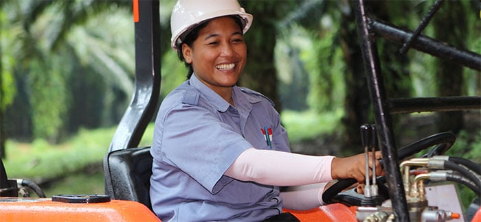 inpage woman driving tractor