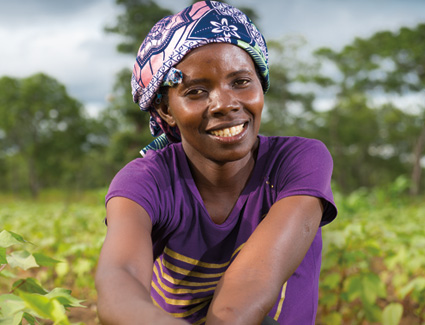 African woman farmer smiling