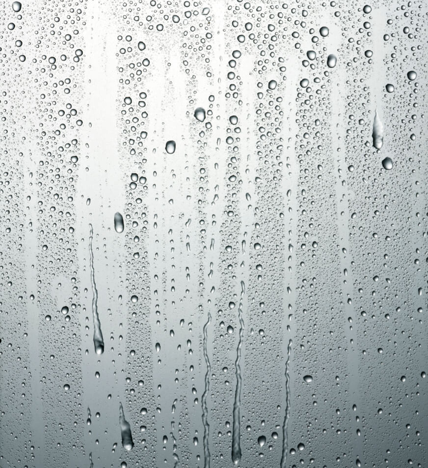 Raindrops dripping down a smooth surface. Raindrops dripping down a smooth surface.