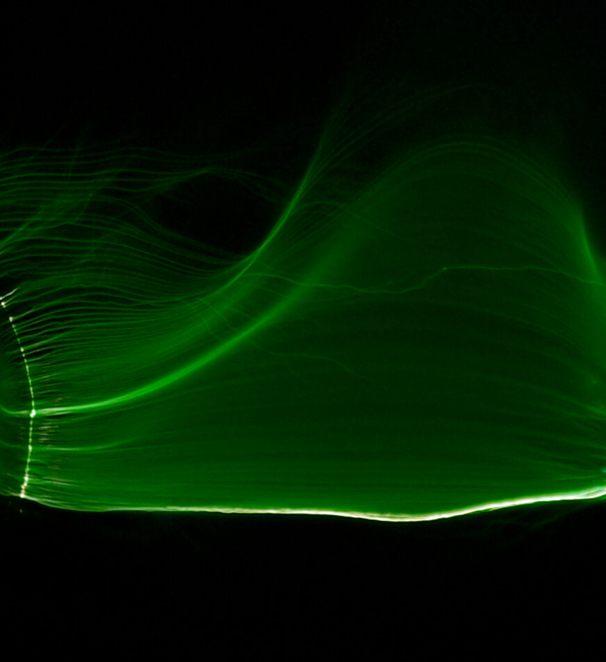 Green tinted Tesla coil arc.