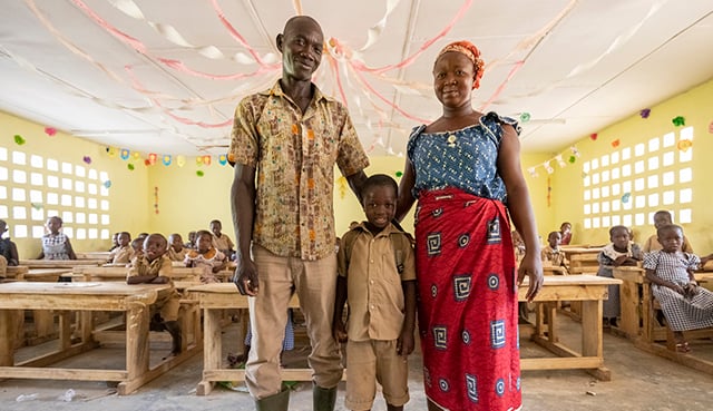 Parents and child in classroom