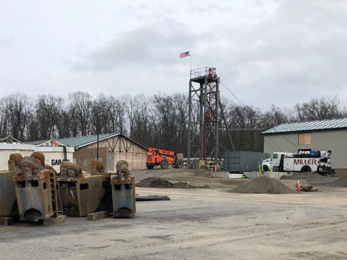 Drill bit removed. Temporary headframe roped up for shaft lining. Drill bit removed. Temporary headframe roped up for shaft lining.