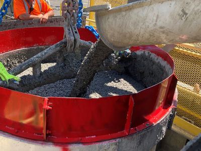 Filling the concrete bucket for a liner pour.