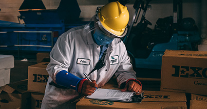 Man signing document on clip board image shows boxes with excel beef