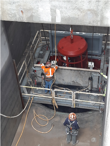 Miners entering shaft for shaft lining. Miners entering shaft for shaft lining.