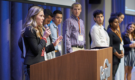 woman speaking on a podium image