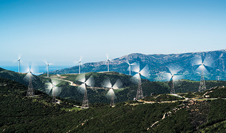 wind turbines on a hill image