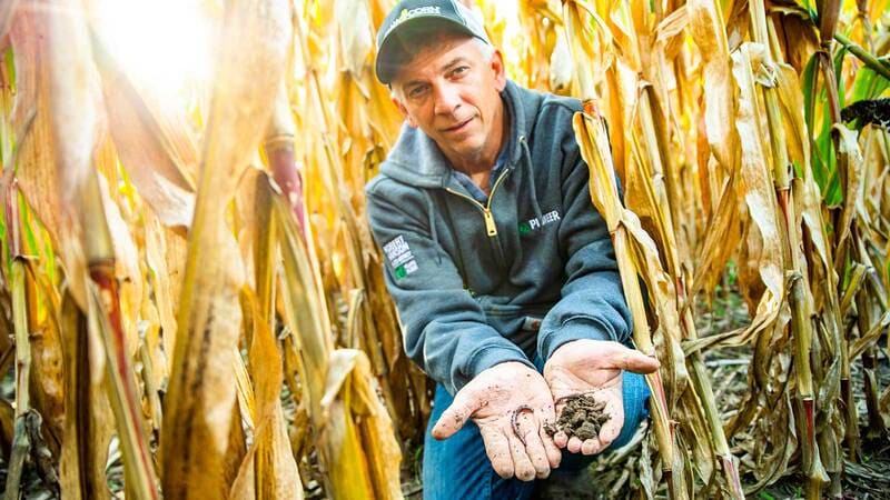 farmer holding soil in hands