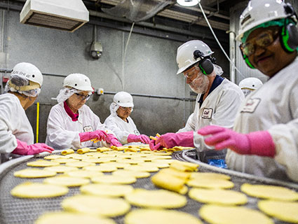 Cargill Employees Work on the Conveyor Belt Cargill Employees Work on the Conveyor Belt