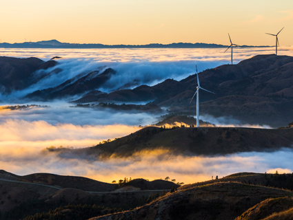 windmills captured on a foggy day landscape