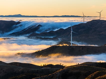 windmills captured on a foggy day landscape