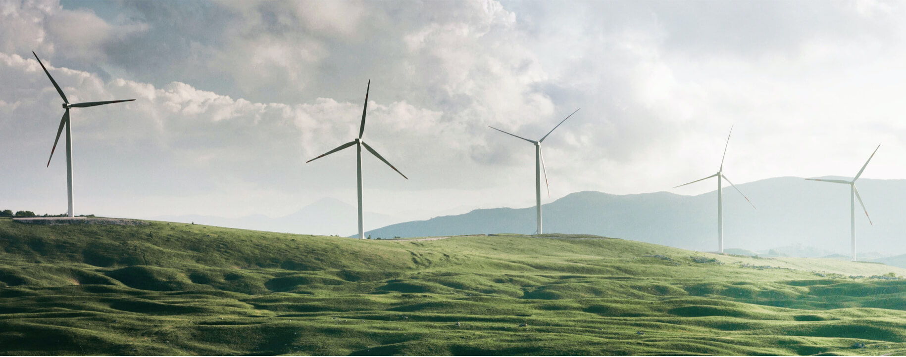 wind turbines on rolling hills