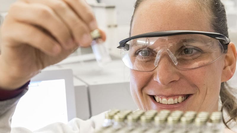 Female scientist examines samples of ingredients for cooking oils at Izgem, Belgium facility GEOS