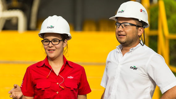 workers with hardhats looking into the distance image