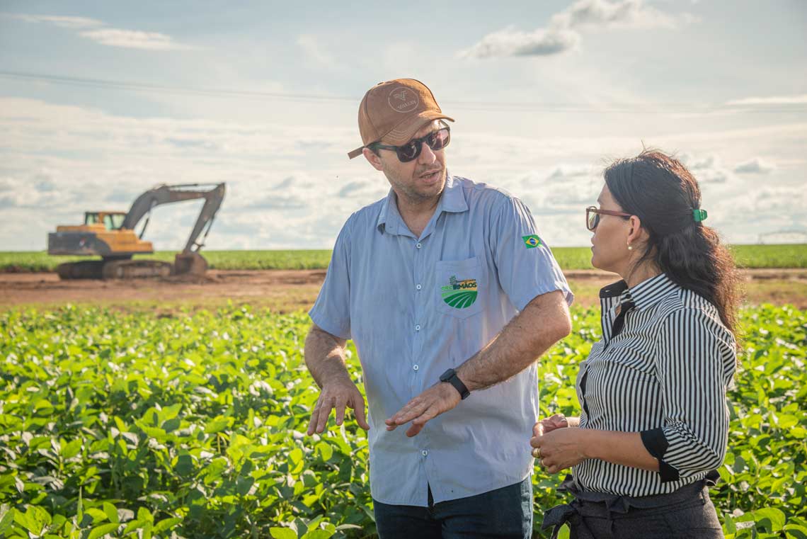 farmers walking around a field image