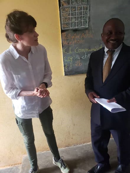 Cameroonian teacher greeting Kate Clancy during a recent visit to his school in Obala