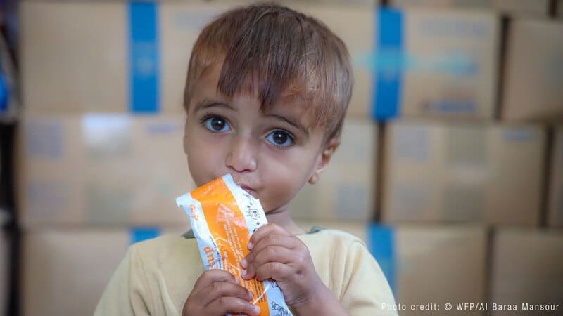child eating food from a package image