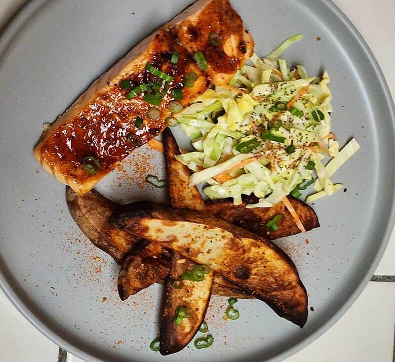 baked salmon fillet with roast potatoes and salad