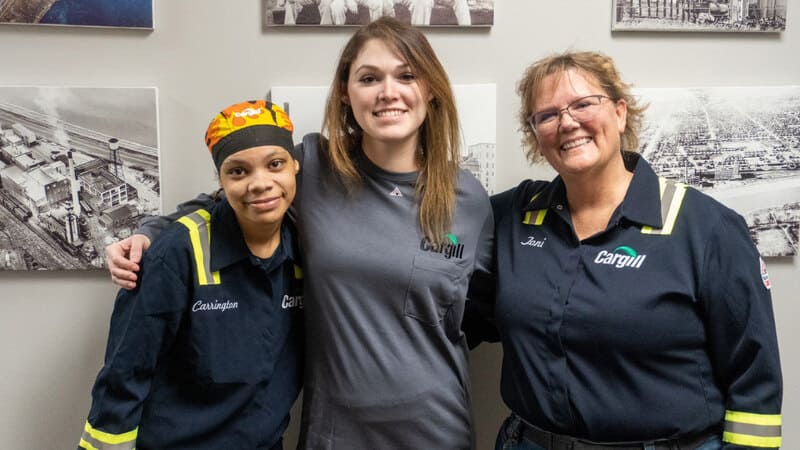 Cargill employees pose in custom-made uniforms