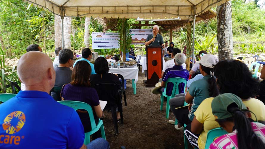 Bernie F. Cruz, PCA National Administrator, addresses the coconut farmers and other attendees at the planting ceremony.