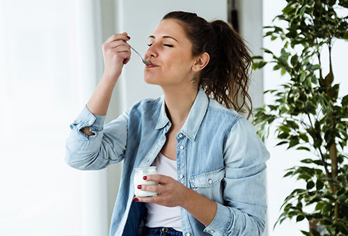 woman eating yoghurt