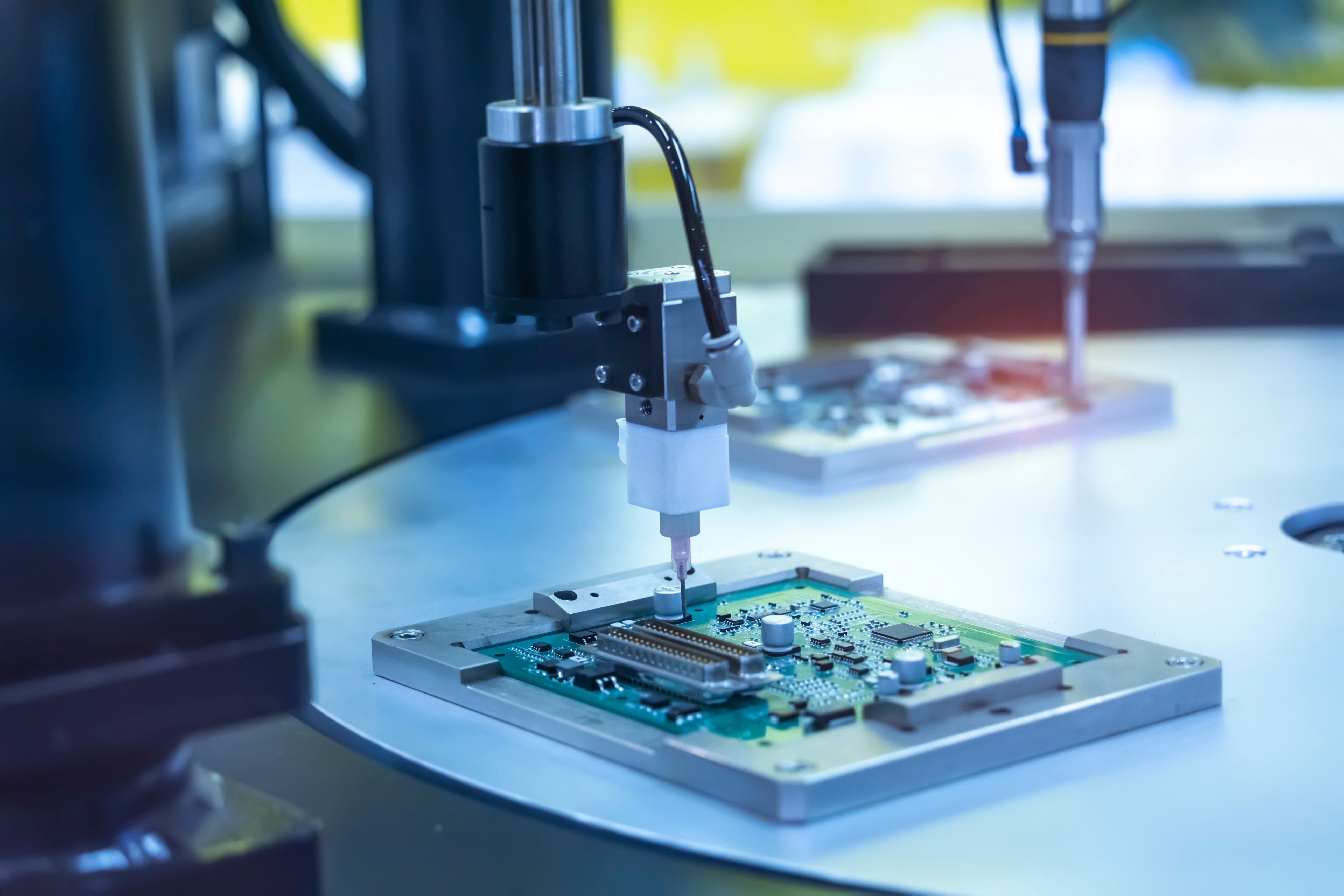Robot holding glue syringe injection on PCB