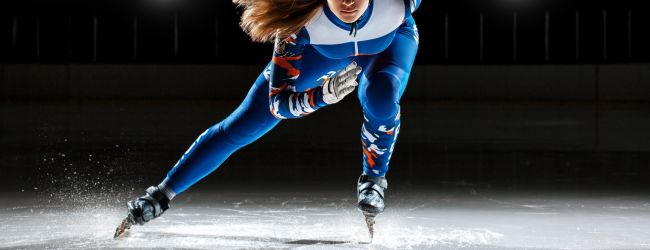 Speed ice skater on skating rink; reduced friction