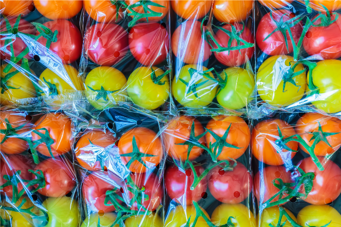Colorful tomatoes in clear plastic packaging Colorful tomatoes in clear plastic packaging