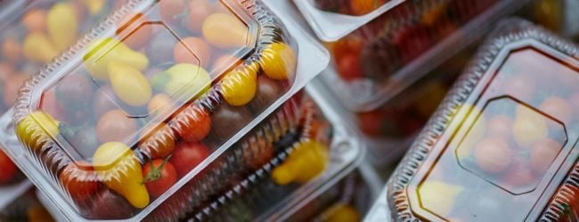 Colorful cherry tomatoes in plastic packaging