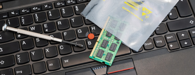 Extra RAM on laptop keyboard in a plastic bag