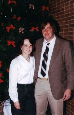 Photo of a man and woman posing together.