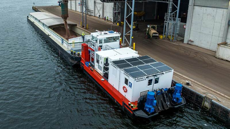 A barge moves through a port. A barge moves through a port.