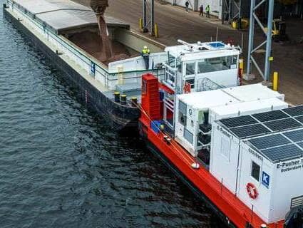 A barge moves through a river. 