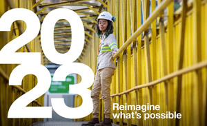 Reimagine what's possible cover image - women on a bridge with hardhat