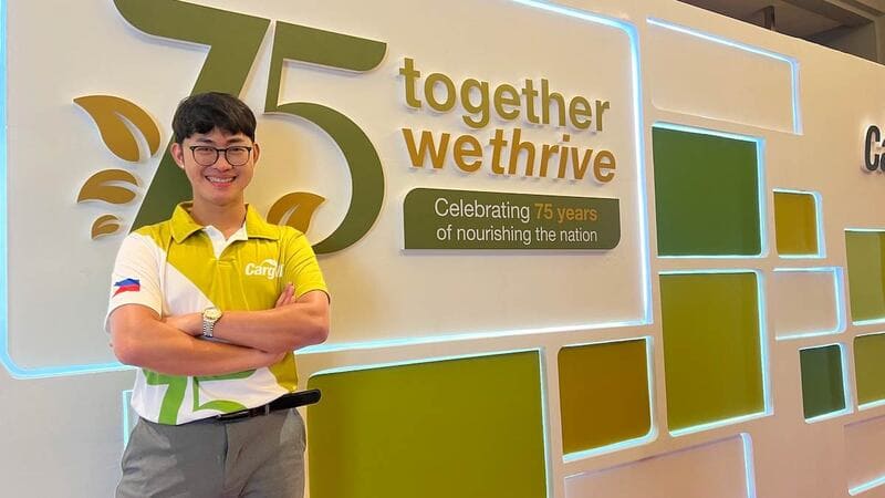 Mark Eugene, a plant manager at Cargill’s poultry facility in Calabarzon, Philippines, stands in front of a feature wall at a Cargill location. Mark Eugene, a plant manager at Cargill’s poultry facility in Calabarzon, Philippines, stands in front of a feature wall at a Cargill location.