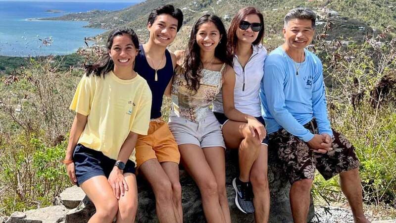 Sokchea’s parents migrated to the United States as refugees fleeing a deadly conflict in Cambodia. Here they share a happy family moment beside the water.