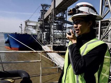 A Cargill facility employee talks on the radio during her shift at the WestWego facility, in Louisiana, United States. 