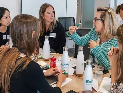 A group of women traders discuss ideas during an event organized by Cargill.