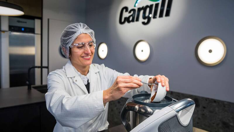 A scientist mixing ingredients to make plant-based foods.