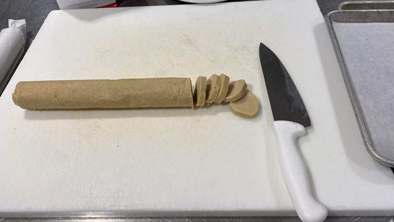 Dough rounded into a log. 