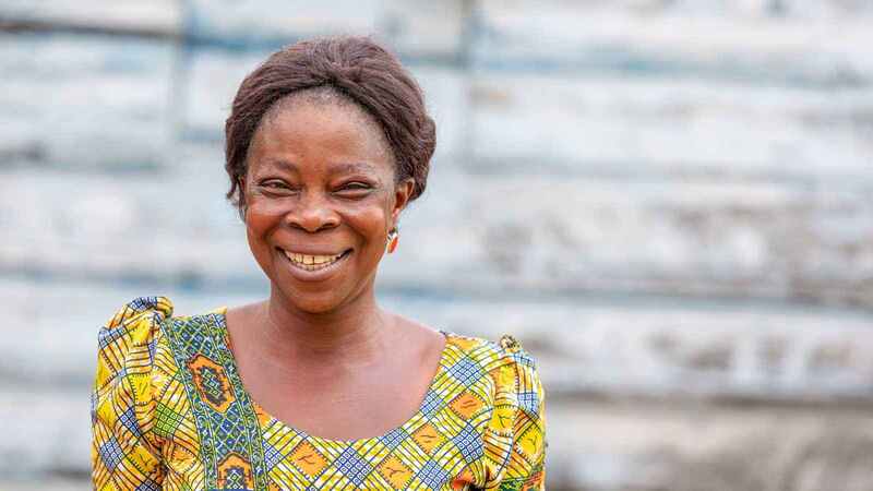 A woman smiling at the camera.