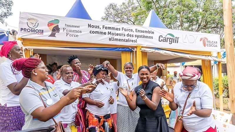 A group of women celebrating and clapping together.