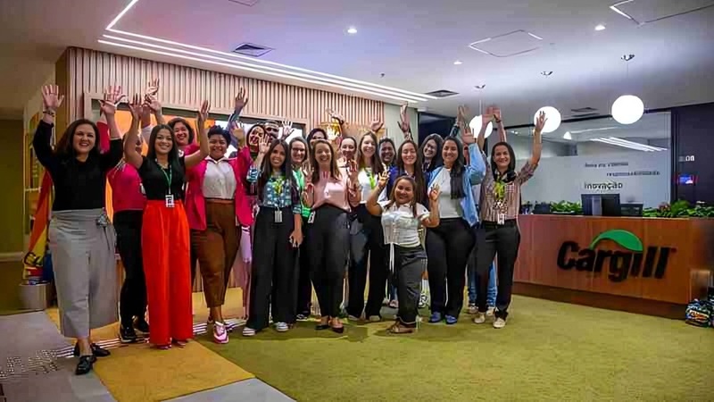 A group of female employees standing in a Cargill office lobby.