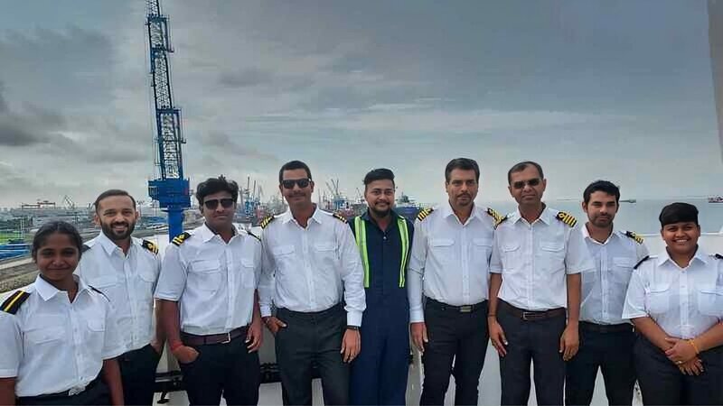 A group of ship officers on the deck of the Pyxis Ocean. 