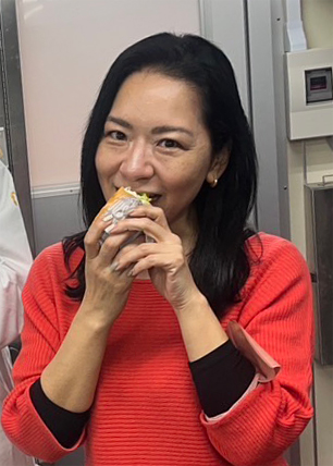 A Cargill account manager bites into a new menu item