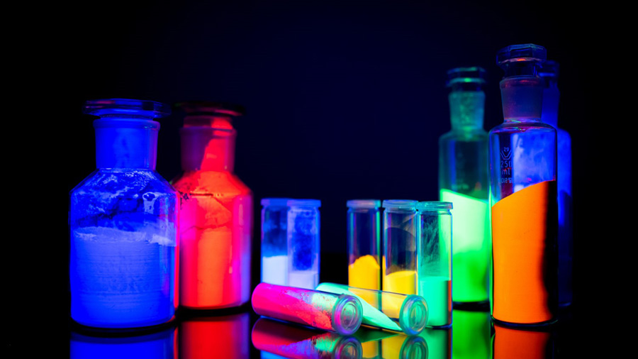 Twelve bottles full of bioluminesent pigment glow in the dark. Twelve bottles full of bioluminesent pigment glow in the dark.