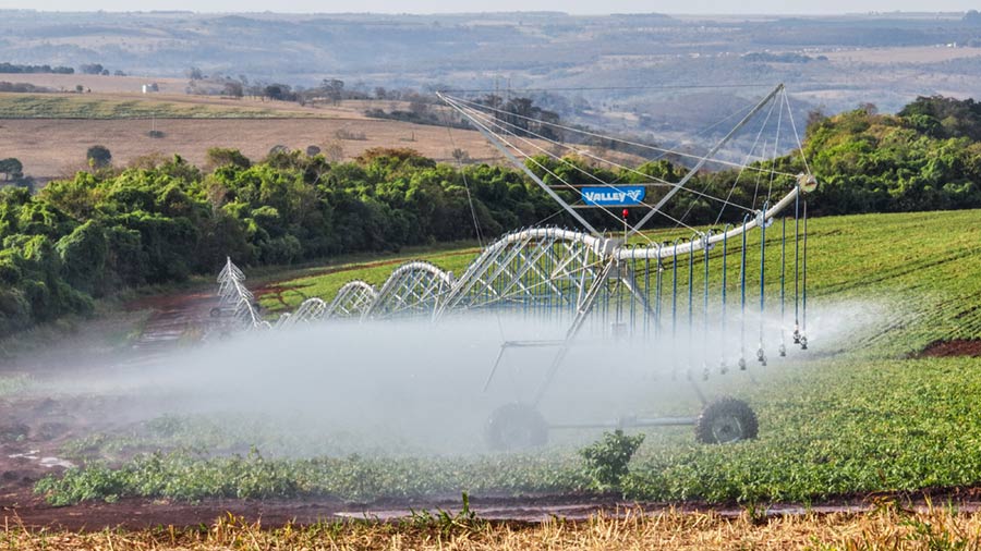 Irrigation technology sprays water on a field. Irrigation technology sprays water on a field.