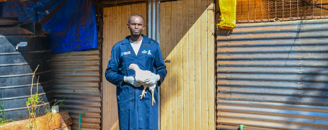 A poultry farmer in Kenya keeps his flock healthier after receiving training from TRANSFORM. A poultry farmer in Kenya keeps his flock healthier after receiving training from TRANSFORM.