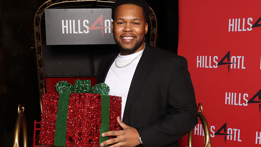 A Cargill employee holds a gift box as he volunteers for a local charity. A Cargill employee holds a gift box as he volunteers for a local charity.
